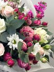 A basket of pink and white flowers