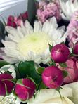 A basket of pink and white flowers