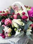 A basket of pink and white flowers