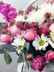 A basket of pink and white flowers