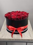 21 red roses in a black box
