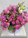 Composition with roses in a blue box