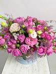 Composition with roses in a blue box