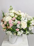 Composition with roses in a white box