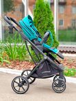 Коляска прогулочная Luxmom 740 с реверсивным блоком, Изумрудная (черная рама) + рюкзак