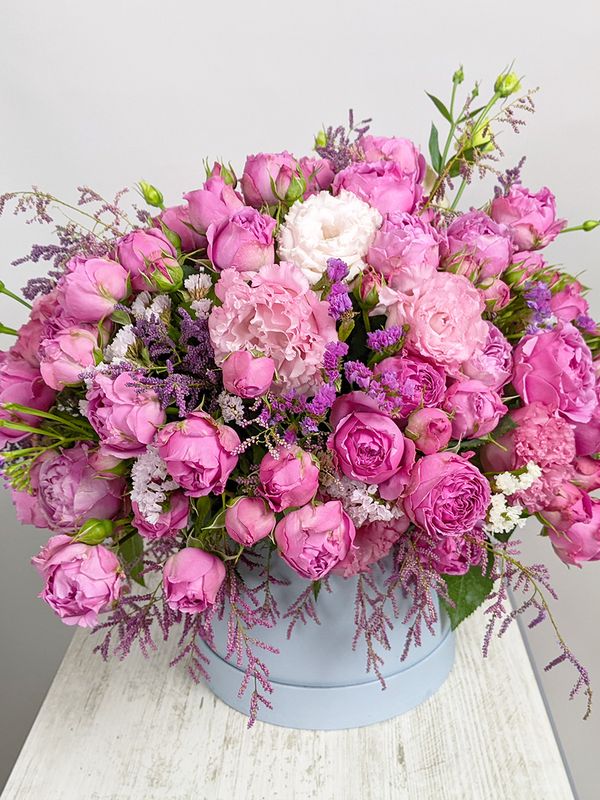 Composition with roses in a blue box