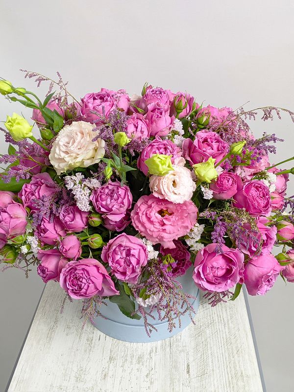 Composition with roses in a blue box