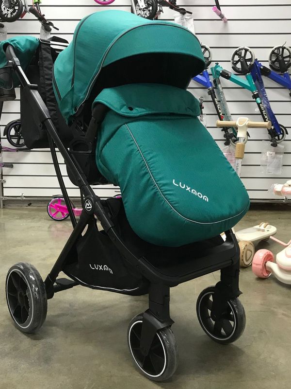 Коляска прогулочная Luxmom 740 с реверсивным блоком, Изумрудная (черная рама) + рюкзак