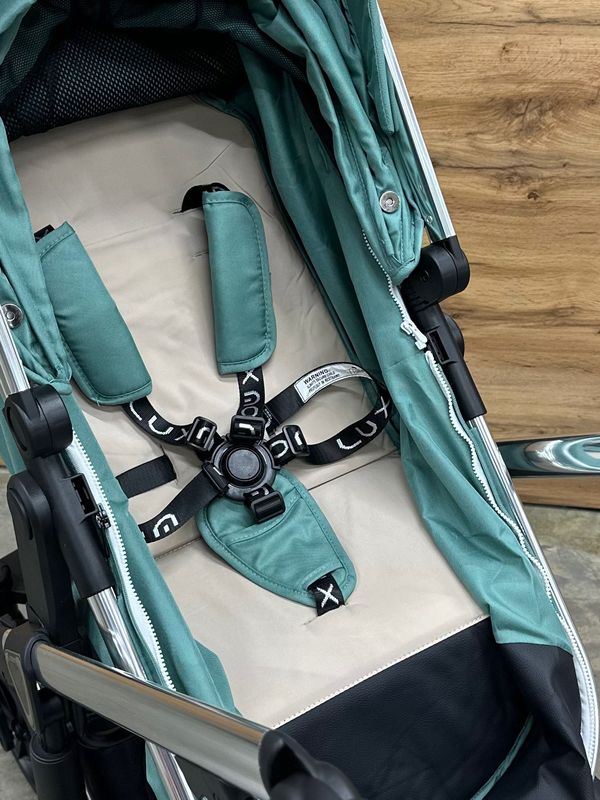 Коляска-трансформер детская Luxmom 570 3B1 (эко-кожа) с автолюлькой ,зеленый