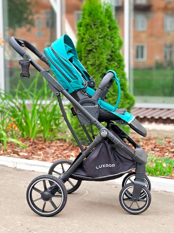 Коляска прогулочная Luxmom 740 с реверсивным блоком, Изумрудная (черная рама) + рюкзак