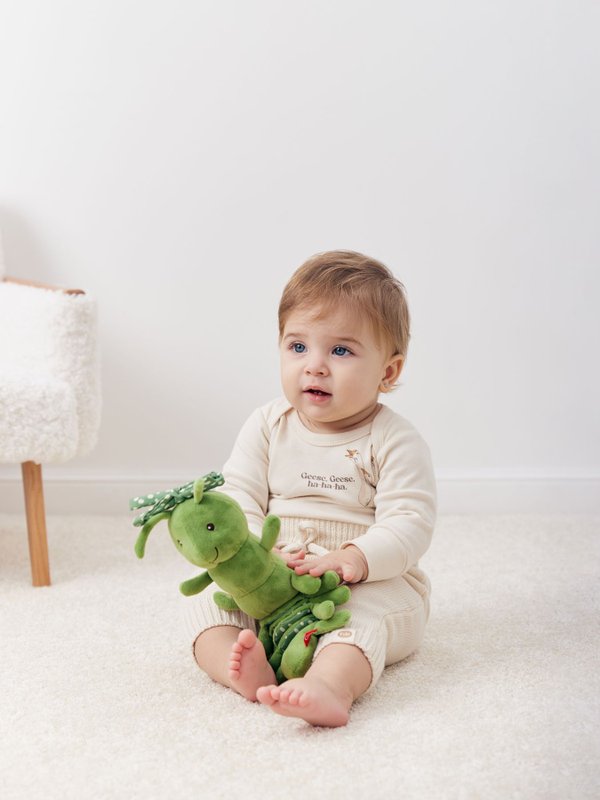 Подвесная игрушка-растяжка с вибрацией Гусеничка (green) Happy baby (0+)