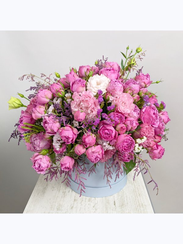 Composition with roses in a blue box