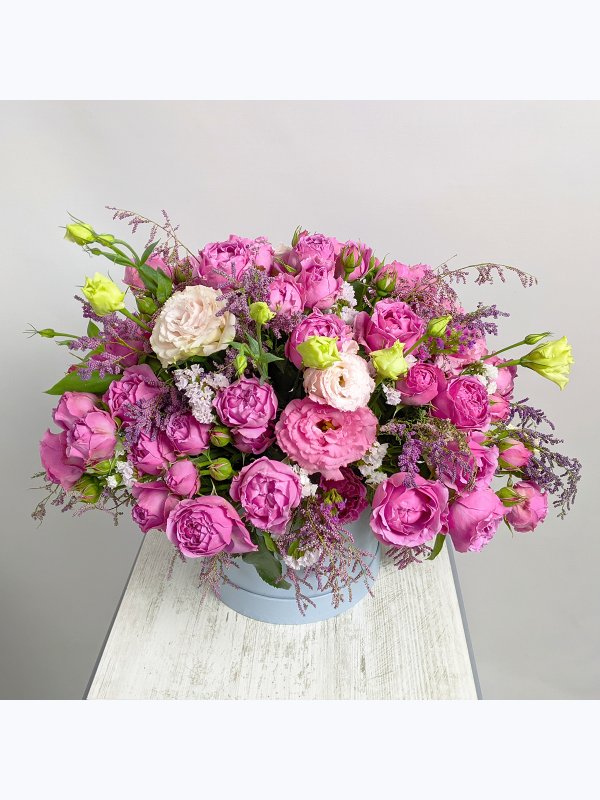 Composition with roses in a blue box
